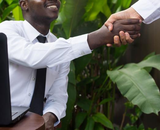 african-business-man-shaking-hands-asian-man