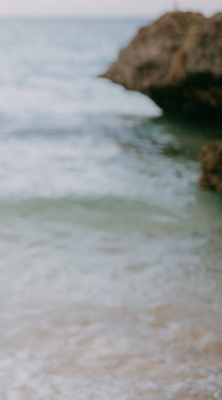 waves crashing on beach and rocks