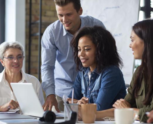 people smiling in conference room